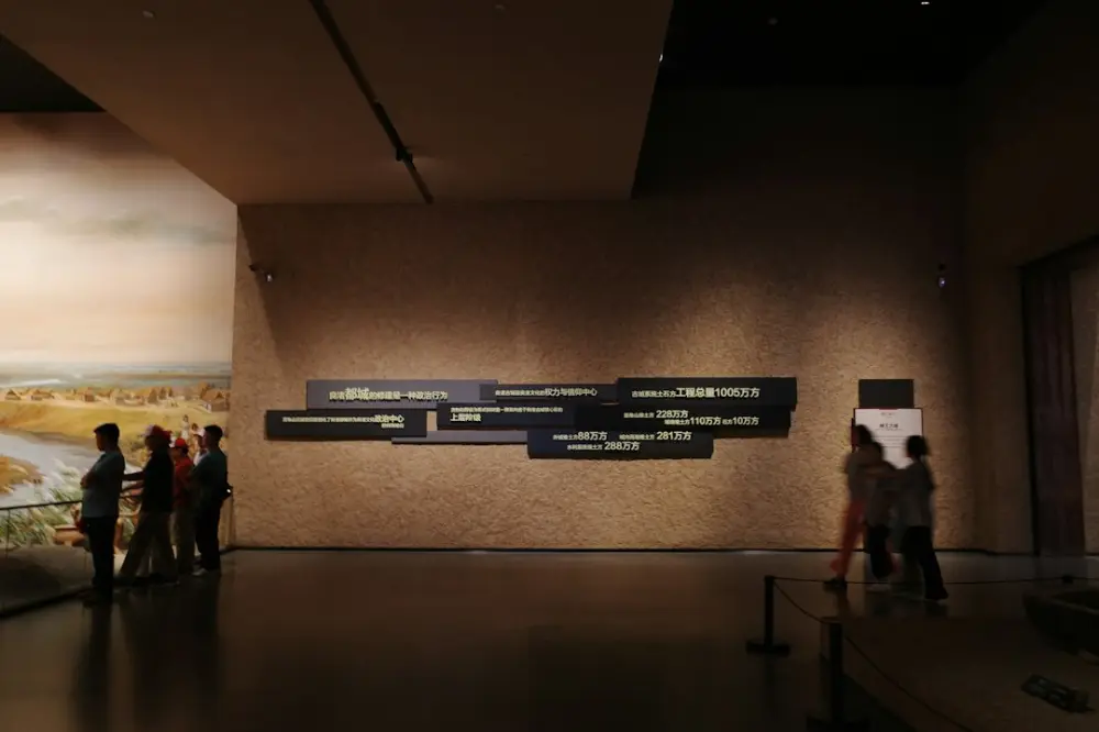 People viewing an exhibit in a museum, illustrating interactive heritage experiences